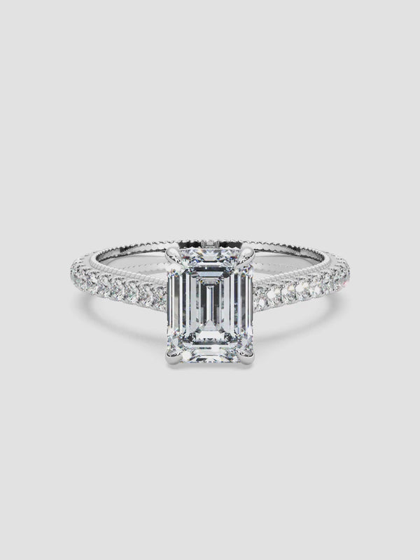 Video of the Anna Belle ring with a striking emerald-cut diamond set in a luxurious 18k white gold band embellished with sparkling pave diamonds.